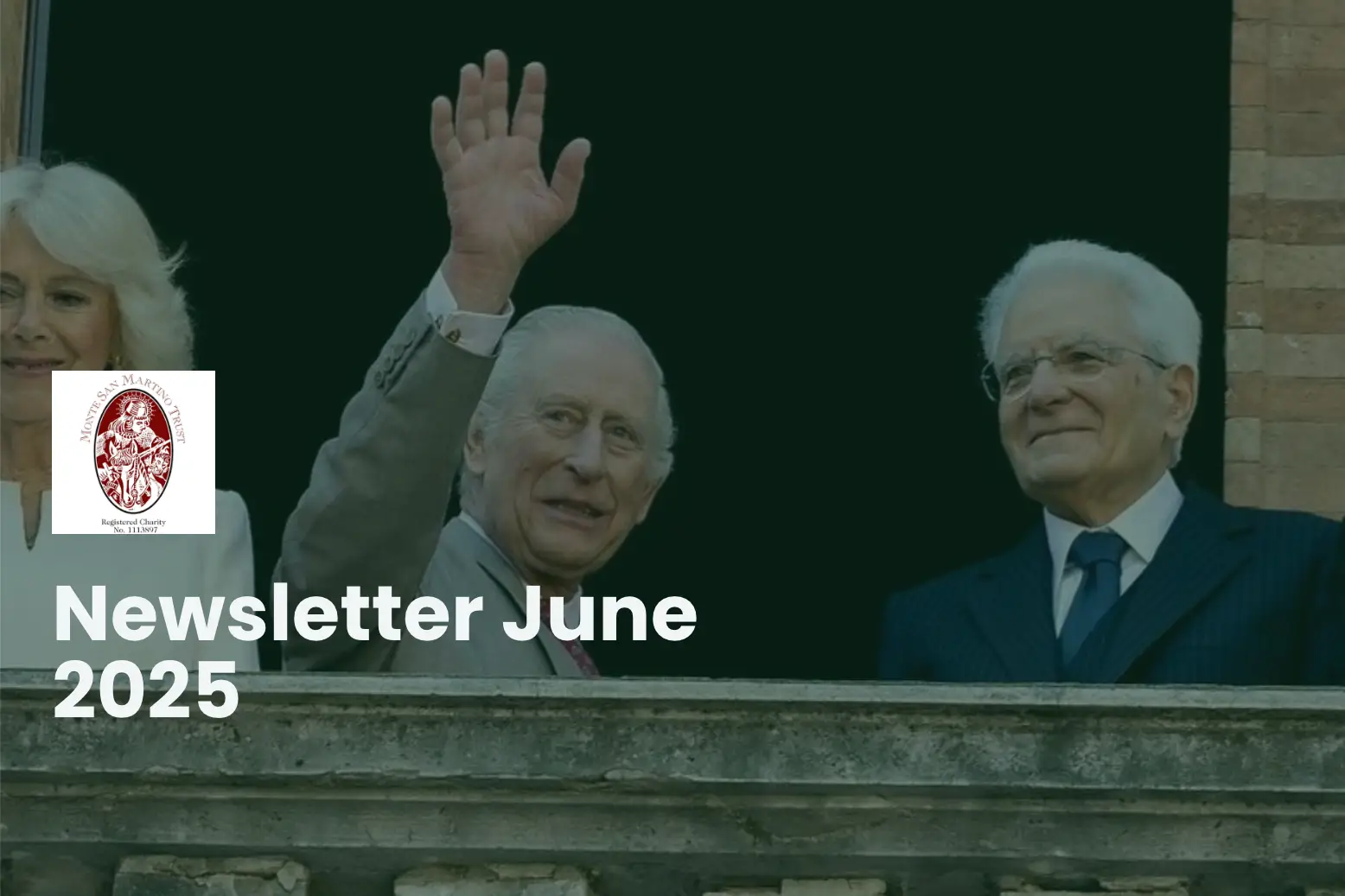 Prince Charles and Queen Camilla waving from a balcony